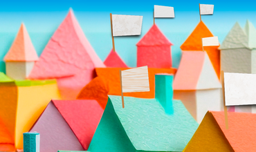 Ilustración de un pueblo de colores con banderas blancas en los tejados